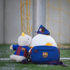 Plush rhino wearing an FC Barcelona jersey – a soft and durable dog toy for playful moments.