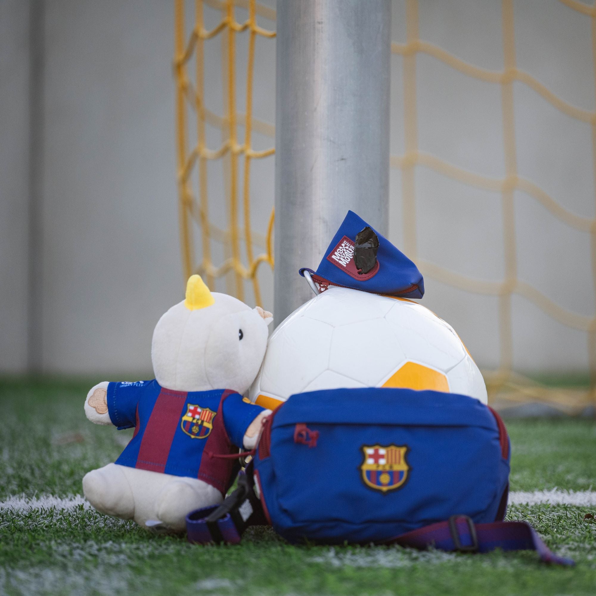 Plush rhino wearing an FC Barcelona jersey – a soft and durable dog toy for playful moments.